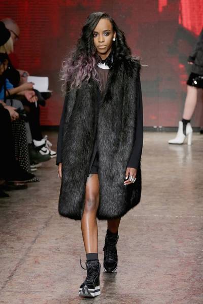 DKNY - Nothing says luxe like a rich fur coat, and this one in ebony is the business. And how dope is the model’s lavender-dipped ‘do?(Photo: Neilson Barnard/Getty Images for Mercedes-Benz Fashion )