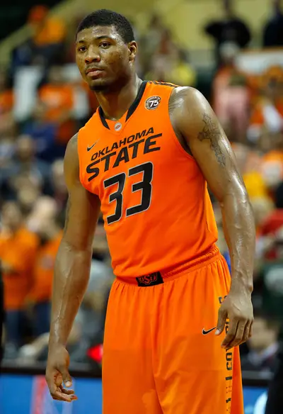 /content/dam/betcom/images/2014/02/Sports/021014-sports-oklahoma-state-guard-marcus-smart-shoves-fan.jpg