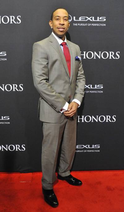 Stand Up - 2014 BET Honors presenter Ludacris looks extremely dapper in his grey suit with complementary tie and pocket square.  (Photo: Larry French/BET/Getty Images for BET)