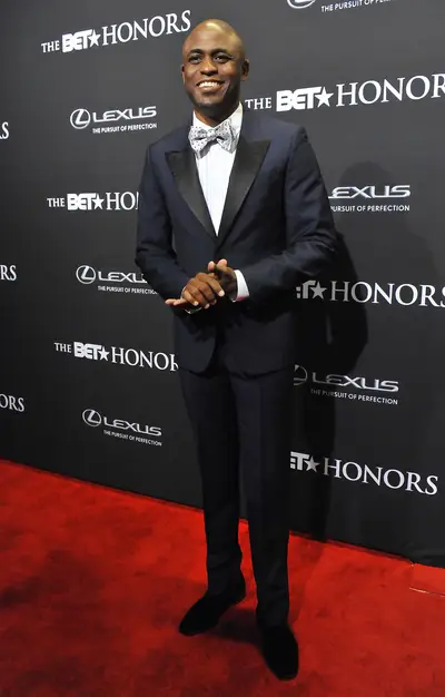 The Host With the Most - The multi-talented Wayne Brady worked the red carpet in his navy blue tux with black accents and his amazing polka-dot bow tie.&nbsp;  (Photo: Larry French/BET/Getty Images for BET)