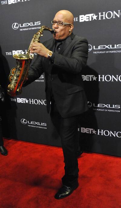 Mr. Saxophone Man - Saxophonist Ski Johnson in all black stunned on the red carpet with his sax in hand!  (Photo: Larry French/BET/Getty Images for BET)