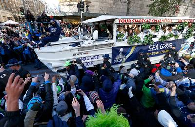 Seattle Seahawks Celebrate Super Bowl XLVIII With Victory Parade - What’s a Super Bowl win without the NFL Championship parade? The Seattle Seahawks and close to one million Seattle fans on Wednesday celebrated their Super Bowl XLVIII victory with a parade to the CenturyLink Field. At a ceremony following the parade, the team dedicated their win to the “12th man” — their fans.(Photo: Jonathan Ferrey/Getty Images)