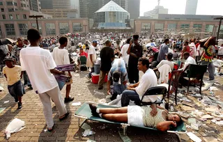 Thousands Left Stranded - Stranded victims of Hurricane Katrina wait outside the Superdome to be evacuated in New Orleans. Thousands of troops poured into the city Sept. 2 to help with security and delivery of supplies in the wake of the storm.&nbsp;(Photo: Mario Tama/Getty Images)