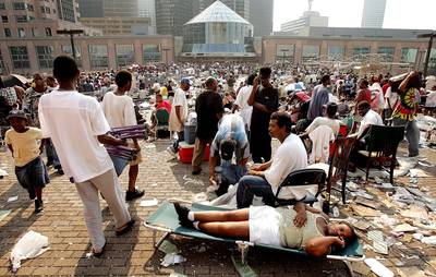 Thousands Left Stranded - Stranded victims of Hurricane Katrina wait outside the Superdome to be evacuated in New Orleans. Thousands of troops poured into the city Sept. 2 to help with security and delivery of supplies in the wake of the storm.&nbsp;(Photo: Mario Tama/Getty Images)