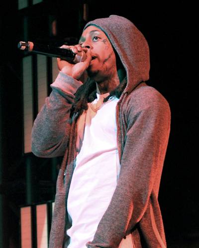 Just the Music - Superstar rapper Lil' Wayne performed at the Nokia Theatre on June 27. Dressed in a white tee and a hoodie, the New Orleans native kept the focus on the music.(Photo: Maury Phillips/BET/Getty Images for BET)