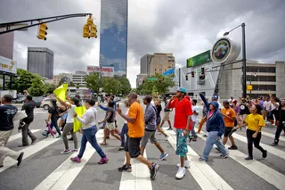 Atlanta Calls for Justice - Thousands of protesters in Atlanta marched to the state capitol on Sunday (July 14) evening.  (Photo: AP Photo/David Goldman)