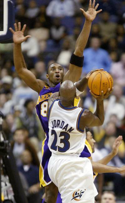 The Student Outclasses the Teacher - Fast-forward to 2002 and Kobe Bryant had three NBA titles under his belt and Michael Jordan was in full swing of his comeback, but with the Washington Wizards. This particular February 2002 game had Jordan scoring 22 points, but being overshadowed by Bryant's 23 points, 15 assists and 11 boards for the triple-double. Imagine the trash talk?&nbsp;(Photo: REUTERS/Gary Hershorn /Landov)