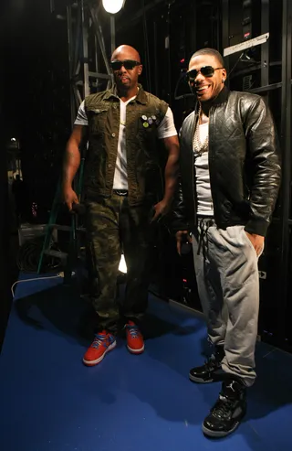 Surprise! - Nelly (R) must have met with a friend backstage. (Photo: Bennett Raglin/BET/Getty Images for BET)