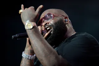 Rick Ross Gets Icy - Ross flosses his jewels on stage during his set at L.A. LIVE for the 2014 BET Experience.  (Photo: Earl Gibson/BET/Getty Images for BET)