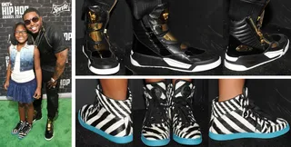 Lil Scrappy and Emani - The rapper/reality show star was looking far from scrappy on the red carpet as he showed off his Versace black leather gold-plated sneakers. He also brought his daughter, Emani, along with him and she was looking exceptionally fashionable as well in her Gucci zebra-print calf hair high-top sneaker. If you like these, check out similar styles at&nbsp;JimmyJazz.com/BET.&nbsp;Get 10% off &amp; free shipping through Nov.15th. Use promo code BET1. Some exclusions apply.  (Photos: Getty Images for BET)