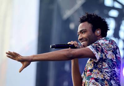 An Unlikely Pairing - Actor Donald Glover got in his zone channeling his alter ego, Childish Gambino. He hit the stage with Ariana Grande to perform their new duet, “Break Your Heart Right Back.&quot; Gambino, who is gearing up for his STN MTN / KAUAI mixtape, continued to captivate the audience with show-stopping performances of “Sweatpants” and “3005.” All without a Drake rant.(Photo: Isaac Brekken/Getty Images for iHeartMedia)