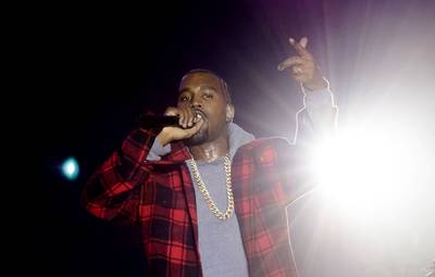 Hometown Hero - Kanye West&nbsp;makes a surprise appearance on stage for the 2014 AAHH!! Fest at Union Park in Chicago.(Photo: Daniel Boczarski/Redferns via Getty Images)