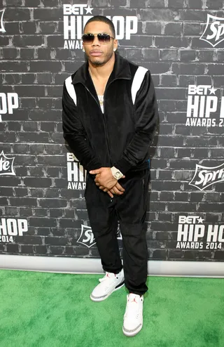 Nelly Strikes a Pose - Nelly keeps it smooth on the green carpet.    (Photo by Bennett Raglin/BET/Getty Images for BET)