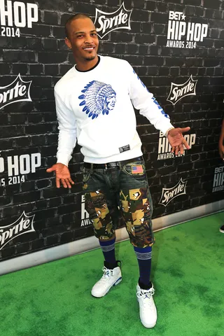 T.I. Gets Playful  - T.I. gets playful in camo accented jean shorts.   (Photo: Johnny Nunez/BET/Getty Images for BET)