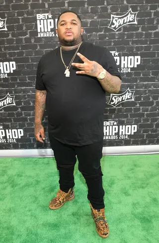 DJ Mustard Goes Earth Tone  - DJ Mustard accents all black with earth-toned sneakers.   (Photo: Bennett Raglin/BET/Getty Images for BET)