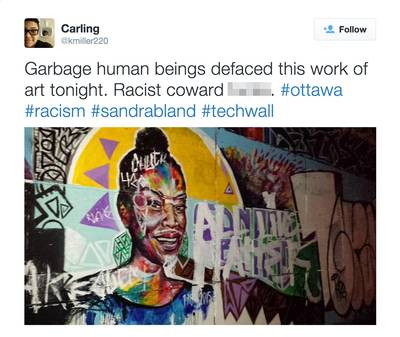 Sandra Bland Mural Defaced, Activists Repair Damage - A beautiful mural of Sandra Bland was vandalized last night in Ottawa, Ontario, the capital of Canada. Someone painted &quot;All Lives Matter&quot; on the artwork painted by graffiti artists Allan Andre and Kalkidan Assefe. A group of activists did their best to repair the damage overnight, according to tweets from @Kmiller220.(Photo: Carling via Twitter)
