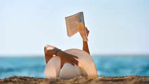 Person reading on the Beach.

