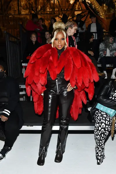 Mary J. Blige wears MCM jumpsuit with plunging neckline while