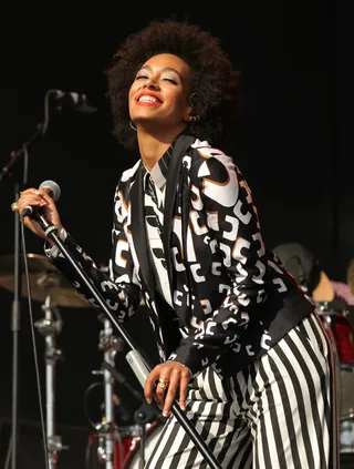 Solange Knowles - The singer goes for '70s rock star in this monochrome three-piece featuring a mixture of bold prints and wide leg bottoms at the Field Day Festival in London.  (Photo: PA PHOTOS /LANDOV)