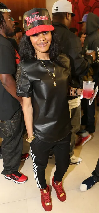 Teyana Taylor - Only Teyana Taylor can pull off this cute and sporty combo. The G.O.O.D. Music artist works her leather shirt with Addias track pants and a matching leather Blackhawks fitted.   (Photo: Aaron Davidson/FilmMagic)