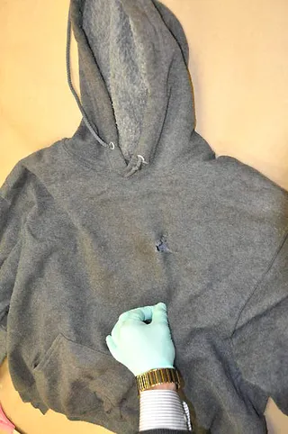 Trayvon's Hoodie - A bullet hole through the garment is visible in this crime lab photo.   (Photo: Sanford District Court)