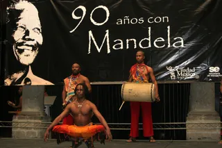 Celebration in Mexico City - A South African music group performs in Mexico City to celebrate the 90th birthday of Mandela in 2008.\r(Photo: Xinhua /Landov)