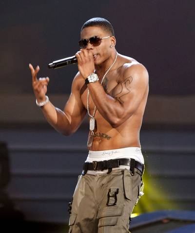 NellyYear: 2004 - When Nelly released his debut album, Country Grammar, in 2000, he was just another skinny kid. At some point, though, the St. Louis MC hit the gym and got ripped. Since covering Men’s Health magazine for the first time in 2004 and becoming known as a fitness enthusiast, Nelly has debuted his own workout video, Celebrity Sweat.&nbsp;(Photo: Kevin Winter/Getty Images)