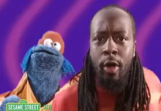 Wyclef Jean - Wyclef Jean taught the Cookie Monster the importance of eating right as they kicked rhymes about including vegetables and fruits in your diet.&nbsp;(Photo: Sesame Workshop Productions)