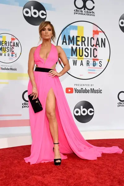 Barbie-Ish&nbsp; - The AMA's Red Carpet was graced by the appearance of Ms. Jennifer Lopez. She is seen wearing full pink couture dress, with a deep neckline and high slit. The dress is from&nbsp;George Chakra's&nbsp;Sping 17 Couture Collection.&nbsp;(Photo: Kevin Mazur/Getty Images)