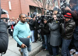 Flashing Lights - Kanye West leaves his apartment in New York City to find a swarm of paparazzi awaiting him outside.&nbsp;(Photo: Dave Spencer / Splash News)