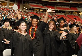 College Graduation Rates in Black and White - The national college graduation rate (which applies to students who entered and graduated from the same institution within six years) for Black students is 44 percent.&nbsp; The rate for white students is 66 percent.(Photo: Mike Moore/Getty Images for University of Phoenix)