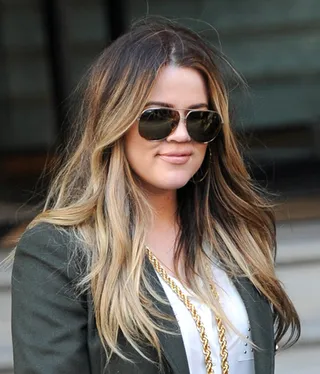 Khloe Kardashian - Khloe gives her thick locks an update with blonde highlights and light brown lowlights.  (Photo: Palace Lee, PacificCoastNews)