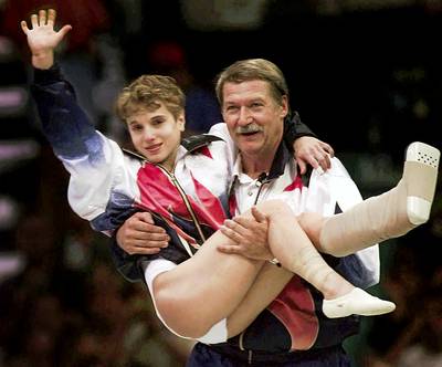 Fighting Through the Pain - Olympian Kerri Strug made a memorable Olympic moment at the 1996 Atlanta Games when she continued with her pole vault competition in spite of an injured ankle — and won the gold medal. (Photo: Susan Ragan /Landov)