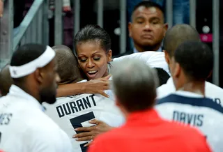 Hug It Out - The first lady and Olympic basketball player Kevin Durant exchange a hug after the U.S. team defeats France by 98 to 71.  (Photo: Pascal Le Segretain/Getty Images)