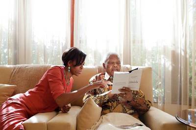 All in the Details - During her 2011 trip to South Africa, First Lady Michelle Obama carved out time for a reading session with Mandela at his home.&nbsp;(Photo: Michelle Obama/Facebook)