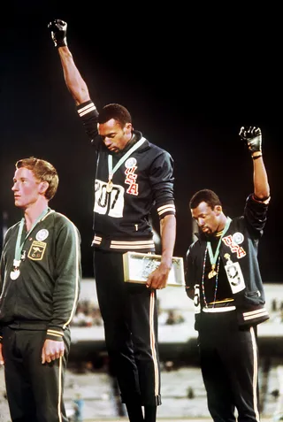 Black Power - American Olympians Tommie Smith (middle) and John Carlos (right) struck this iconic pose at the Award Ceremony for the 200m race at the 1968 Olympic Games in Mexico City to bring global awareness to the plight of Black Americans.&nbsp;(Photo: DPA/LANDOV)