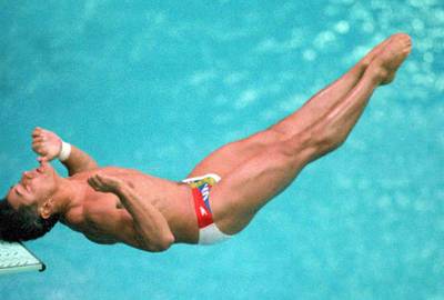 A Bump on the Head - HIV positive Olympic diver Greg Louganis made international headines when he hit his head on a diving board during the 1988 Olympics in Seoul. Louganis went on to win two gold medals at the games despite the accident. (Photo: BRIAN SMITH/AFP/Getty Images)