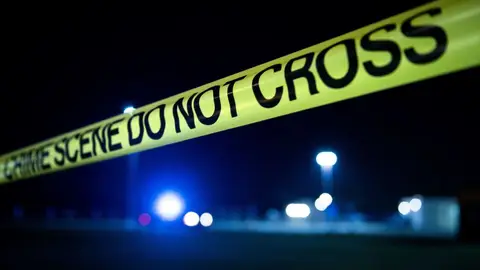 Crime scene tape is seen after a mass shooting at Santa Fe High School May 18, 2018 in Santa Fe, Texas. - Ten people, mostly students, were killed when a teenage classmate armed with a shotgun and a revolver opened fire in a Texas high school May 18, 2018, the latest deadly school shooting to hit the United States. The gunman, arrested on murder charges, was identified as Dimitrios Pagourtzis, a 17-year-old junior at Santa Fe High School. He is being held on capital murder charges, meaning he could face the death penalty. (Photo by Brendan Smialowski / AFP)        (Photo credit should read BRENDAN SMIALOWSKI/AFP via Getty Images)