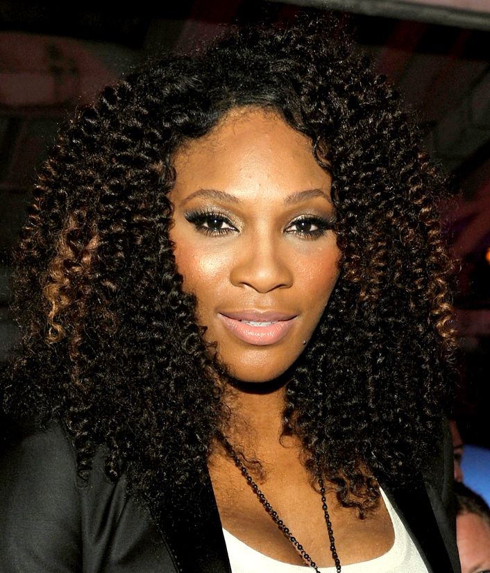 Image of Nia Long natural curls with a high bun Best Man