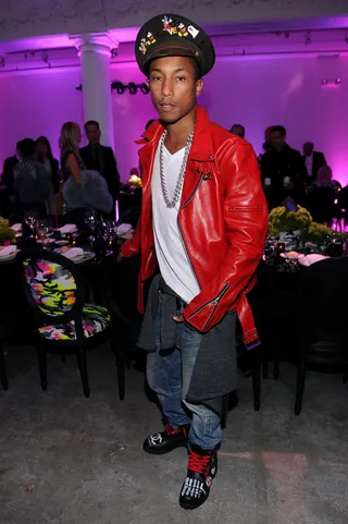 Future of Fashion\r - Pharrell Williams, in loads of layers, visits the Dior pop-up shop featuring designs by German artist, Anselm Reyle, for Dior at Miami Design District in South Beach. (Photo: Dimitrios Kambouris/Getty Images)