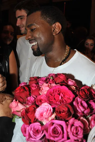 Kanye, the Fashion Designer \r - ‘Ye’s usual ice grills melted into all smiles backstage after the show as supporters congratulated him with hugs and roses. It was a long time coming for the fashion aficionado, who beefed up his fashion knowledge by interning at Fendi and Louis Vuitton. He also consulted with Central Saint Martins professor Louise Wilson on the direction of the collection and tapped designer Louise Goldin and several grad students from Central Saint Martins to produce the clothes.