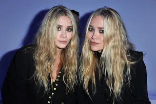 Celebrity Designers Unite\r - Designers Mary Kate and Ashley Olsen (behind brands the Row and Elizabeth and James) both put on LBDs to come support Kanye at his first runway show.\r\r(Photo by Pascal Le Segretain/Getty Images)