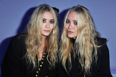 Celebrity Designers Unite\r - Designers Mary Kate and Ashley Olsen (behind brands the Row and Elizabeth and James) both put on LBDs to come support Kanye at his first runway show.\r\r(Photo by Pascal Le Segretain/Getty Images)