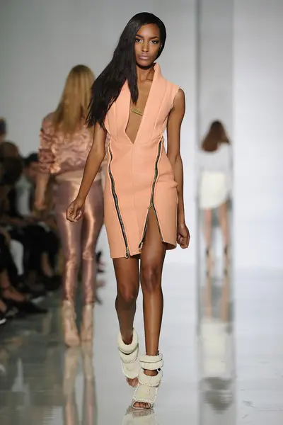 Top Models Part Deux\r - Jourdan Dunn was also among mega-models that walked in the show. Here she modeled one of the key colors in the palate of the collection. Kanye chose beige, white and black hues with reds and cobalt blues providing a pop of color.&nbsp; \r\r(Photo by Pascal Le Segretain/Getty Images)