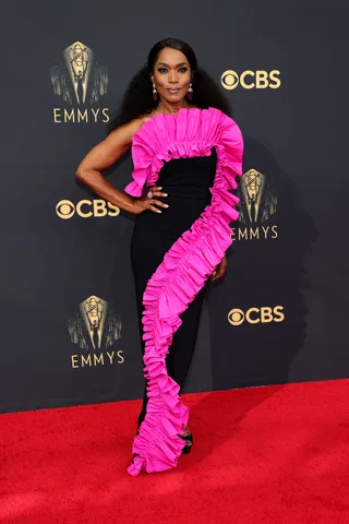 Angela Bassett - Angela Bassett looked absolutely stunning in a black dress with fuschia ruffled detailing that accentuated her curves by Greta Constatine.&nbsp; (Photo by Rich Fury/Getty Images)