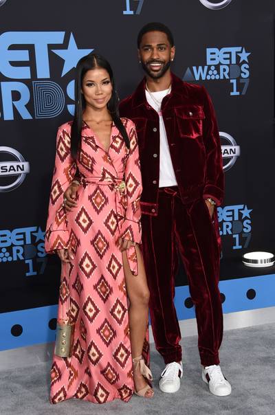 2017: Jhené Aiko and Big Sean - Rapper Big Sean stepped onto the scene at the BET Awards draped in deep red velvet. To complement her beau’s bold attire, singer Jhené Aiko donned&nbsp; a 70s-inspired maxi dress featuring eye-catching red accents.&nbsp; (Photo credit should read CHRIS DELMAS/AFP via Getty Images)