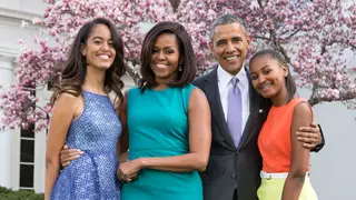 U.S. President Barack Obama, First Lady Michelle Obama, and daughters Malia (L) and Sasha (R) pose for a family portrait with their pets Bo and Sunny in the Rose Garden of the White House on Easter Sunday, April 5, 2015 in Washington, DC. 