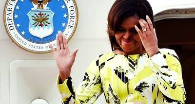 Dateline: Tokyo, March 18, 2015 - Obama waves upon her arrival at Haneda International Airport in Tokyo for a three-day visit as part of a drive to promote girls' education around the world.(Photo: Toshifumi Kitamura/AFP/Getty Images)