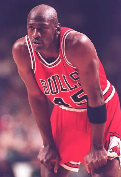 Michael Jordan of the Chicago Bulls shoots a jumper against John