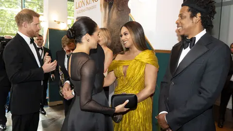 TOPSHOT - Britain's Prince Harry, Duke of Sussex (L) and Britain's Meghan, Duchess of Sussex (2nd L) meets cast and crew, including US singer-songwriter BeyoncÃ© (C) and her husband, US rapper Jay-Z (R) as they attend the European premiere of the film The Lion King in London on July 14, 2019. (Photo by Niklas HALLE'N / POOL / AFP) (Photo by NIKLAS HALLE'N/POOL/AFP via Getty Images)